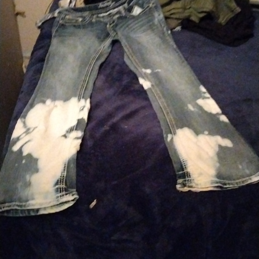 Blue stained jeans belt bottoms